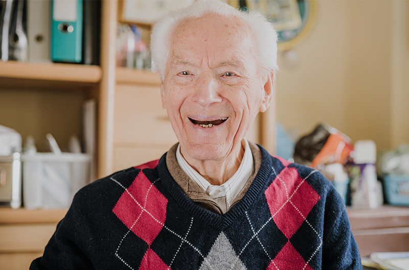 Smiling senior man wearing an argyle sweater